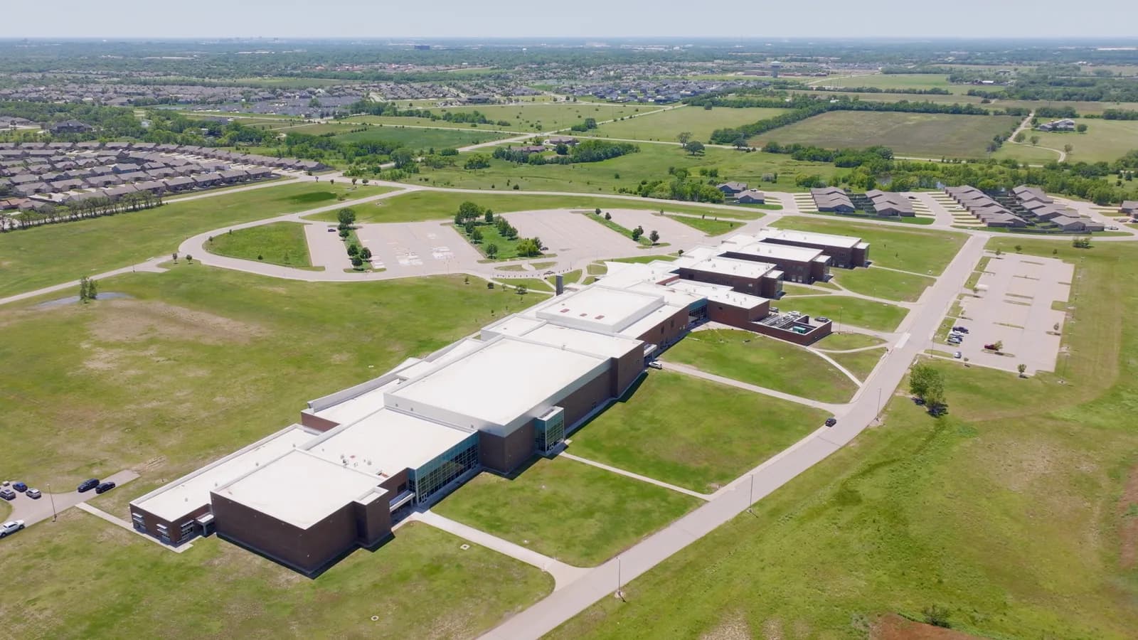 Aerial view of a large school building near Bel Aire