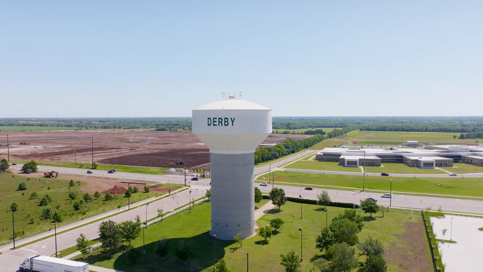 The white Derby water tower with the city behind it